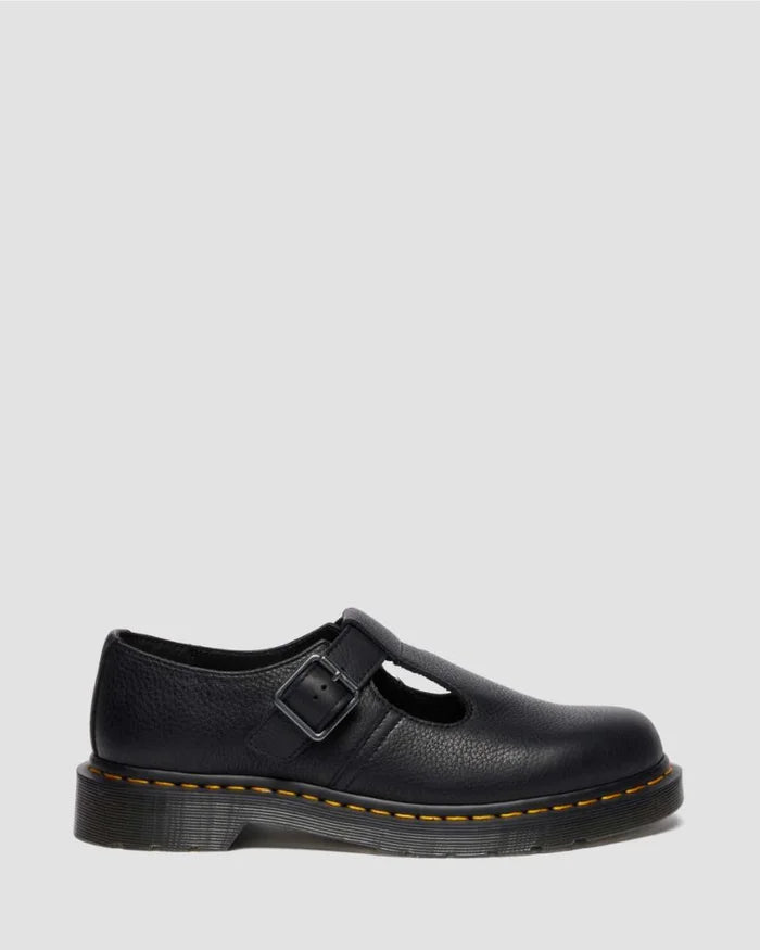 Black leather shoe with a buckle on a light gray background