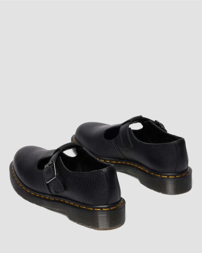 Pair of black leather shoes on a light gray background