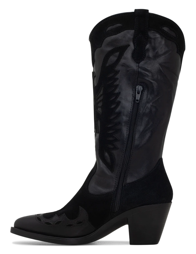 A black suede boot with a pointed toe, decorative suede leather overlays, and a low heel.