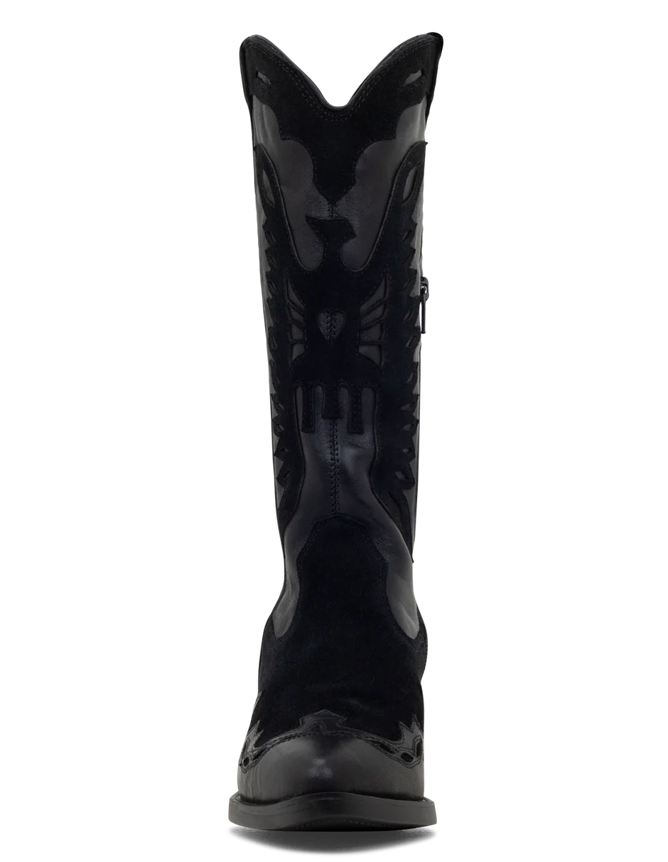 A black suede boot with a pointed toe, decorative suede leather overlays, and a low heel.