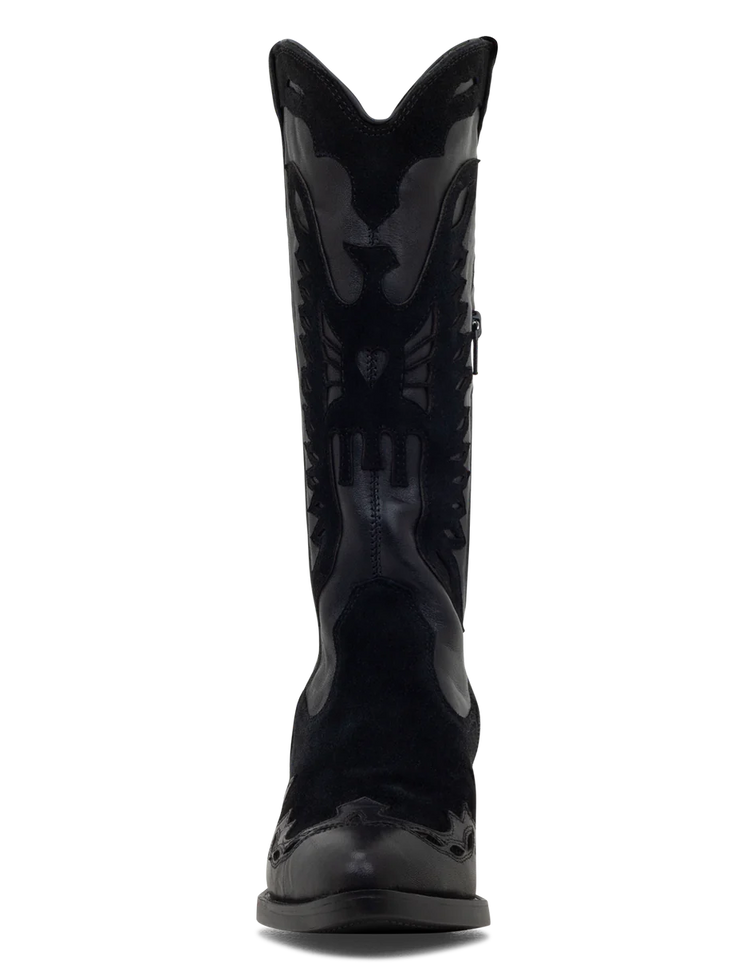 A black suede boot with a pointed toe, decorative suede leather overlays, and a low heel.