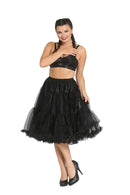 Woman wearing a black tiered skirt on a white background