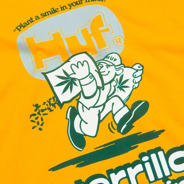 HUF logo with a cartoon character planting a seed on an orange background