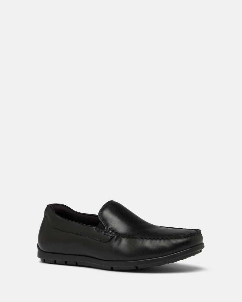 A single black loafer shoe with a rubber outsole, designed for casual wear.