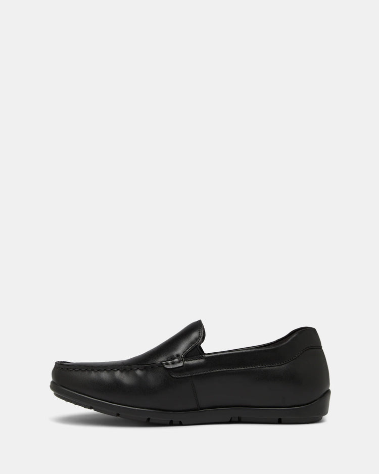Black loafer shoe on a white background