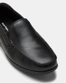Black leather loafer shoe on a white background