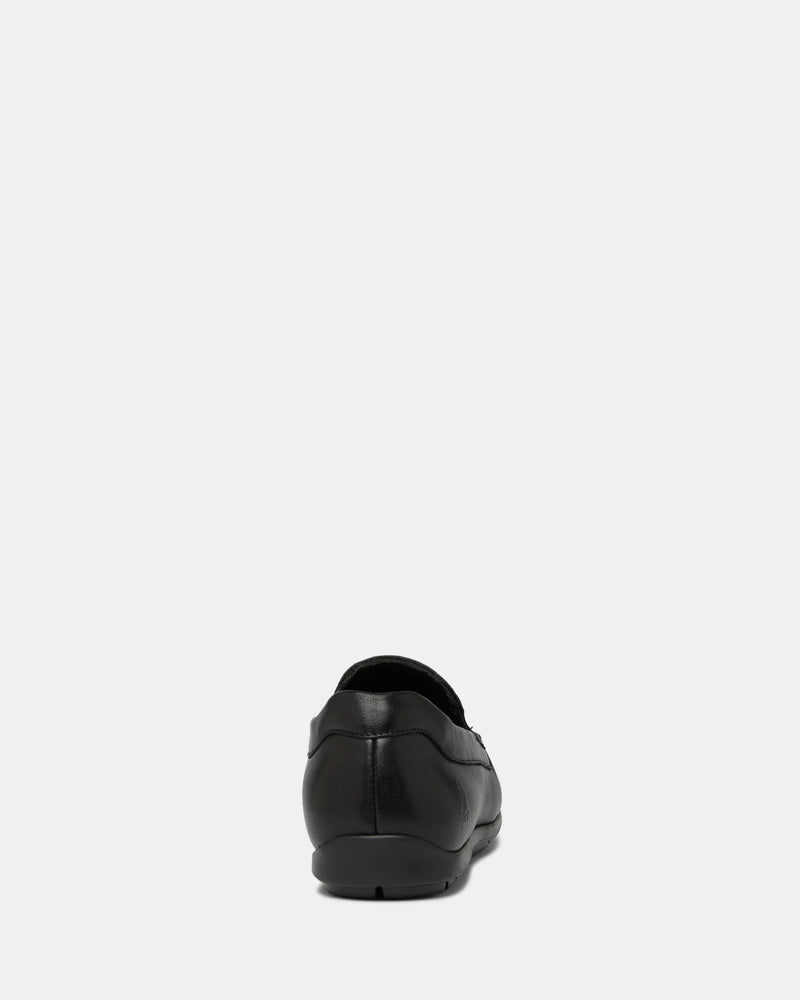Black leather loafer on a white background