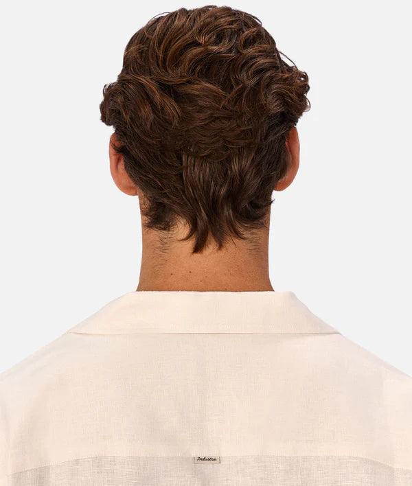 Man with styled hair from behind on a white background