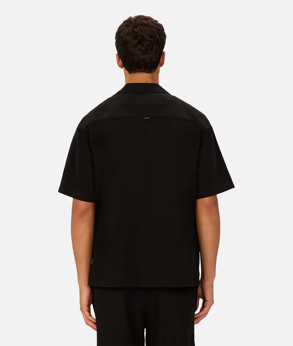 Person wearing a black shirt on a white background