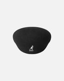 Black beret with a kangaroo logo on a light gray background