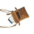 Brown leather crossbody bag with a phone inside on a white background