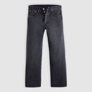 Pair of dark gray jeans on a light gray background