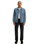 Person wearing a blue denim jacket on a white background