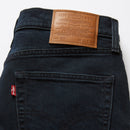 Close-up of Levi's jeans with a brown leather label on a white background