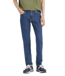 Person wearing blue jeans and a green shirt on a white background