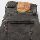 Gray Levi's jeans with a visible brand label on a light gray background