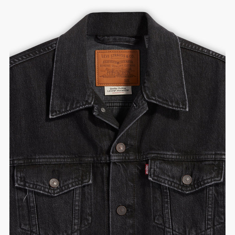 Black denim jacket with Levi's branding on a white background