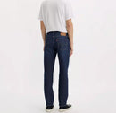 Person wearing dark blue jeans and a white shirt on a white background