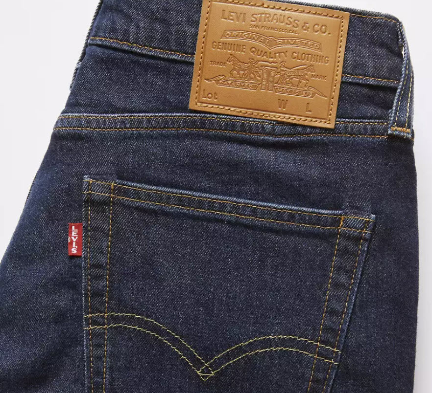 Close-up of Levi's jeans with brand label and logo on a white background