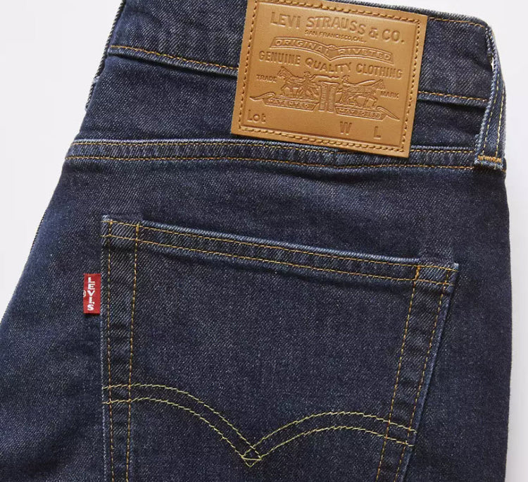 Close-up of Levi's jeans with brand label and logo on a white background