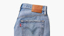 Close-up of a Levi's denim product with a visible brand label on a white background