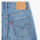 Close-up of Levi's jeans with brand label and logo on a white background