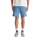 Person wearing blue denim shorts on a white background
