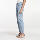 Light blue jeans worn by a person on a white background