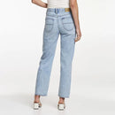 Light blue jeans worn by a person on a white background