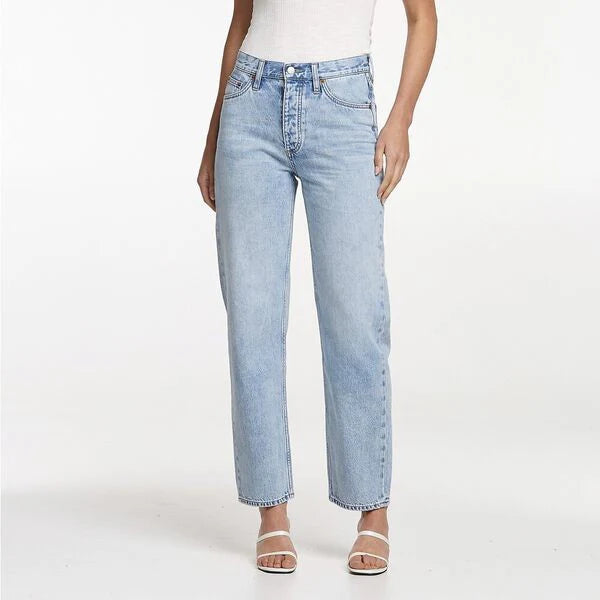 Light blue jeans worn by a person on a white background