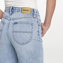 Light blue jeans with a visible brand label on a white background