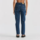 Blue jeans worn by a person on a white background