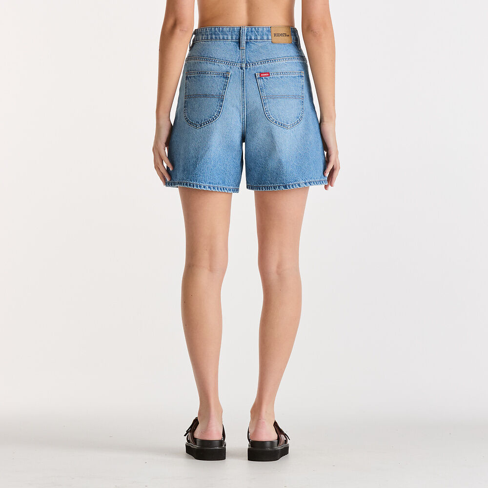 Person wearing light blue denim shorts on a white background