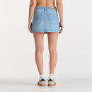 Light blue denim skirt worn by a person on a white background