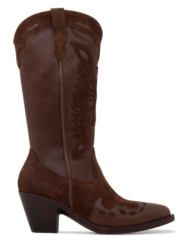 A tan suede boot with a pointed toe, decorative leather overlays, and a chunky heel.