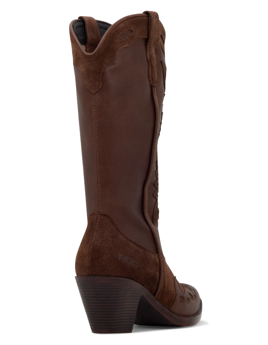 A tan suede boot with a pointed toe, decorative leather overlays, and a chunky heel.
