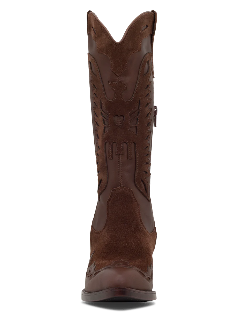 A tan suede boot with a pointed toe, decorative leather overlays, and a chunky heel.