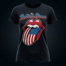 A black short-sleeve crewneck t-shirt featuring a distressed graphic of The Rolling Stones' iconic tongue and lips logo filled with an American flag design, with 'The Rolling Stones' text above it.