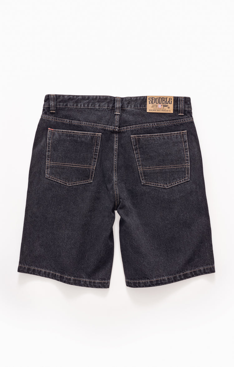Back view of dark blue denim shorts with a brand label on a white background