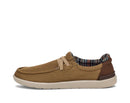 Brown casual shoe with plaid lining on a white background