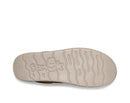 Sole of a shoe with a visible brand logo on a white background