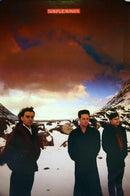 Three men standing in a snowy landscape with 'Simple Minds' logo at the top.