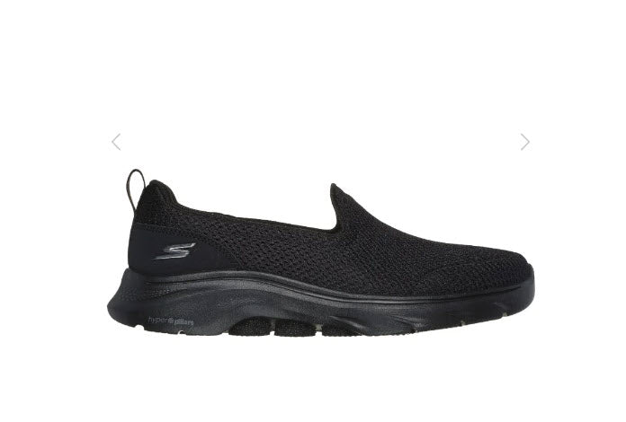 A pair of Skechers GO Walk 7 - Razi black slip-on athletic shoes with a mesh upper and a flat, wide sole.