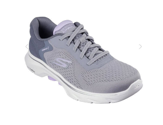 A pair of Skechers GO walk 7 Cosmic Waves walking shoes for women, featuring a gray engineered mesh upper with stretch laces, a Skechers logo detail, and purple accents.