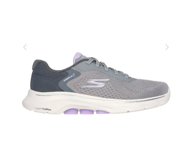 A pair of Skechers GO walk 7 Cosmic Waves walking shoes for women, featuring a gray engineered mesh upper with stretch laces, a Skechers logo detail, and purple accents.