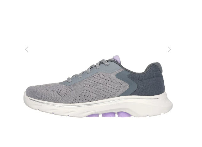 A pair of Skechers GO walk 7 Cosmic Waves walking shoes for women, featuring a gray engineered mesh upper with stretch laces, a Skechers logo detail, and purple accents.