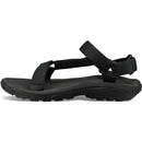 Black sandal with a strap on a white background