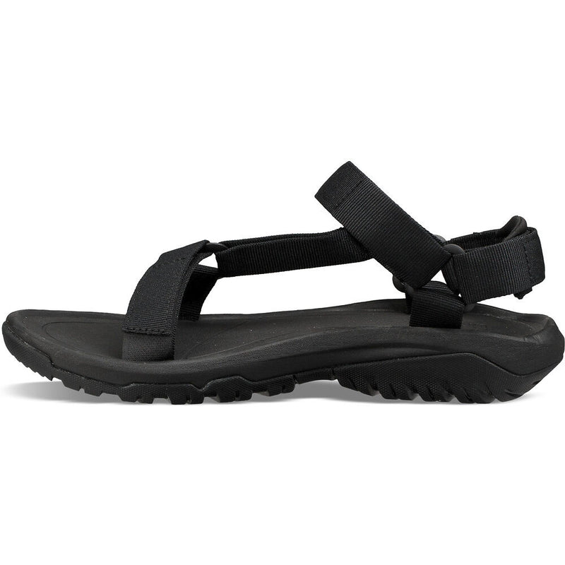 Black sandal with a strap on a white background