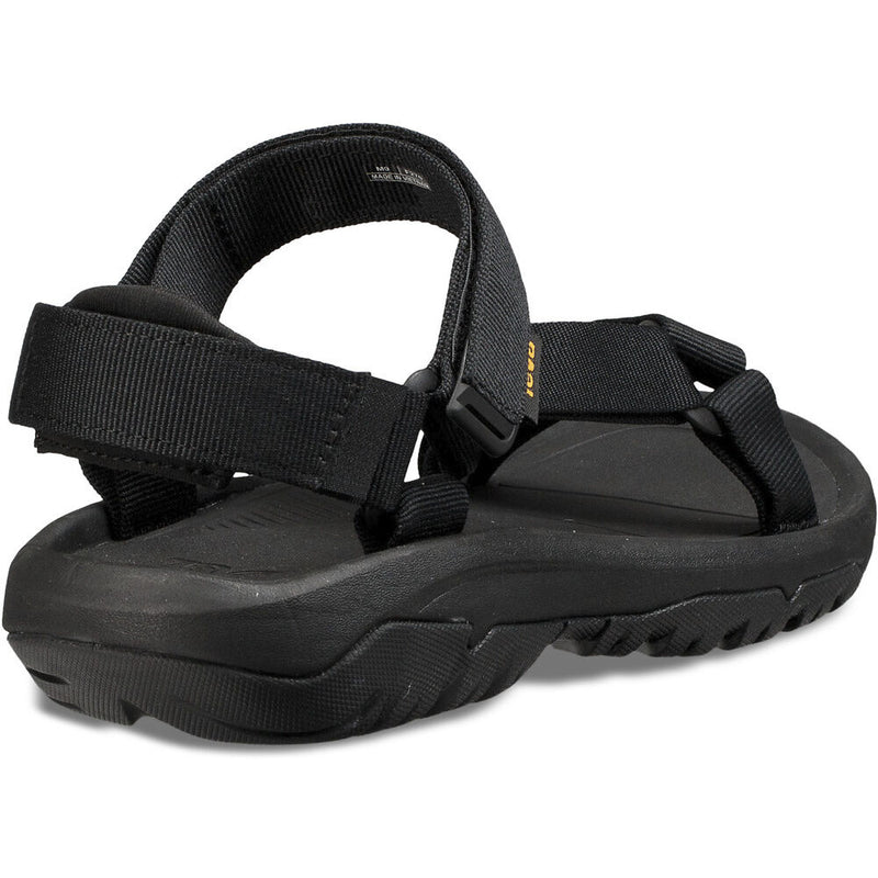 Black sandal with multiple straps on a white background
