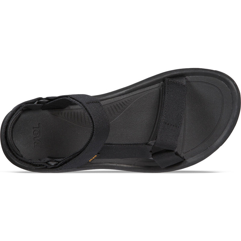 Black sandal with a brand logo on a white background